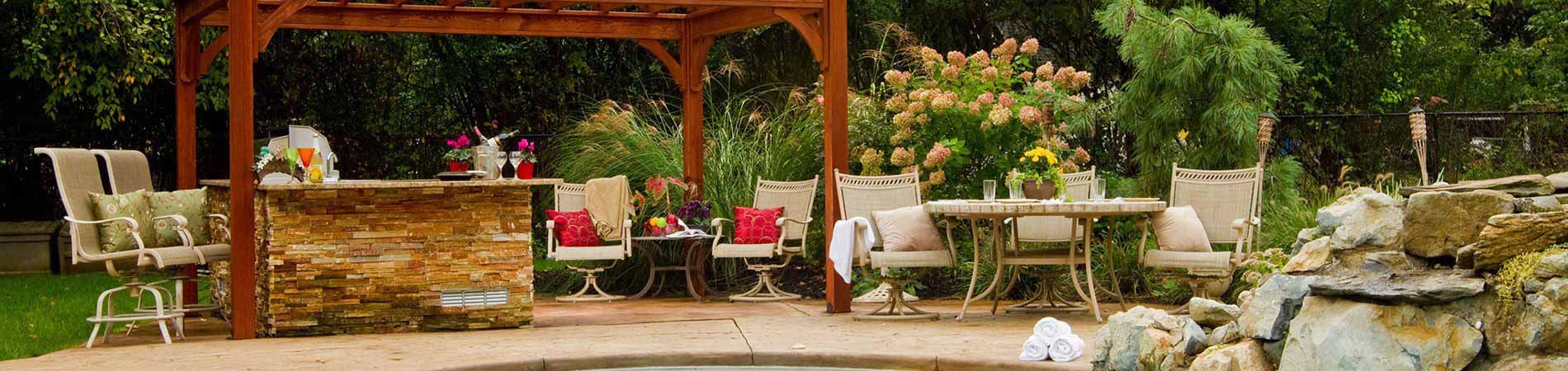 Wooden pergola with chairs and table